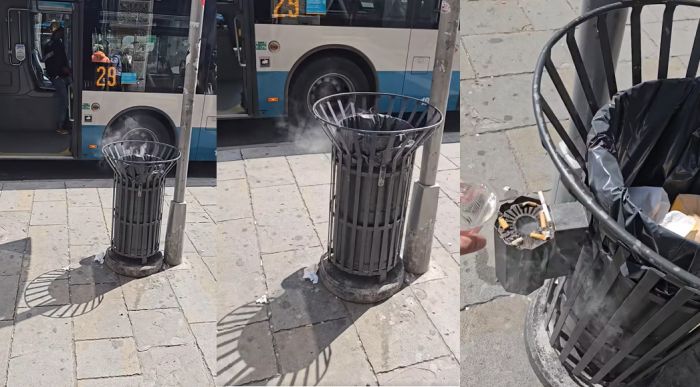 Piazza Goldoni, mozzicone non spento e cestino in fumo: scena sotto gli occhi dei passanti (VIDEO)